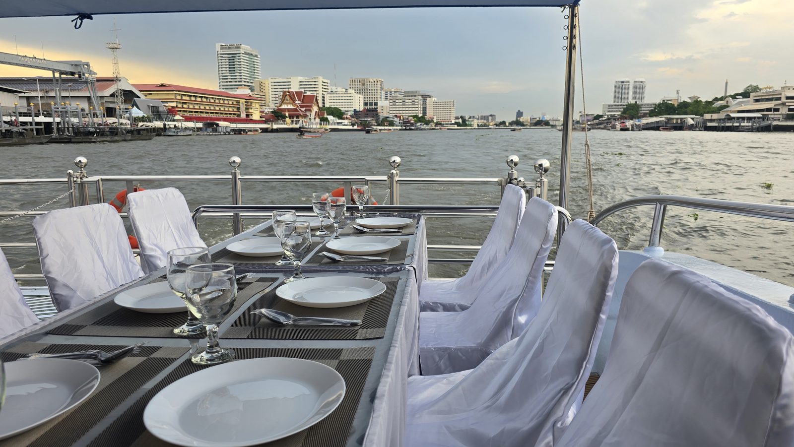 An intimate riverside dinner setting for a proposal or anniversary