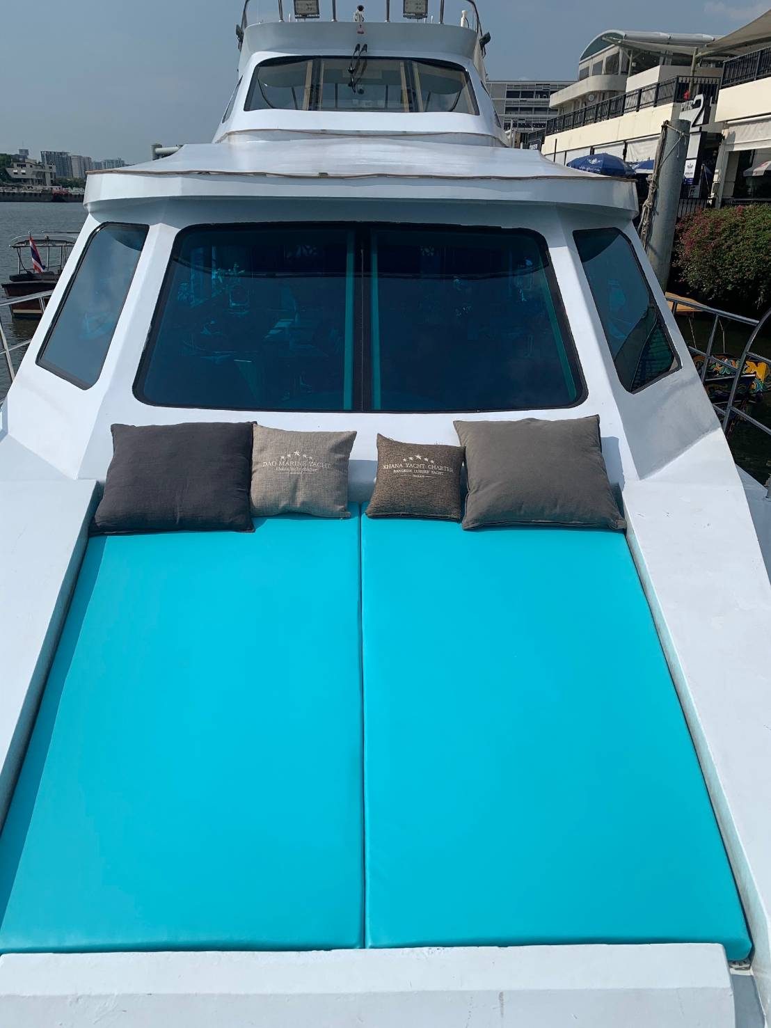 Cushioned seating area on the bow of DAOMARINE YACHT